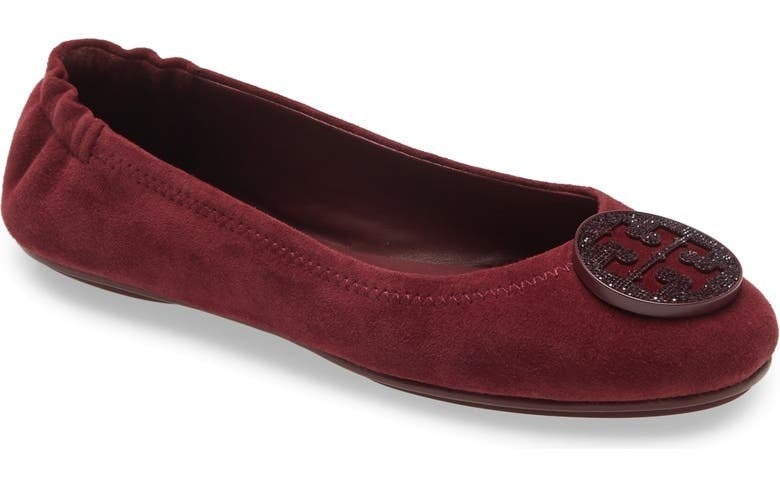 burgundy tory burch flat shoes with an elastic back