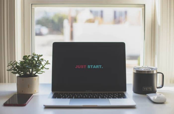 A laptop with a message &quot;Just Start&quot;