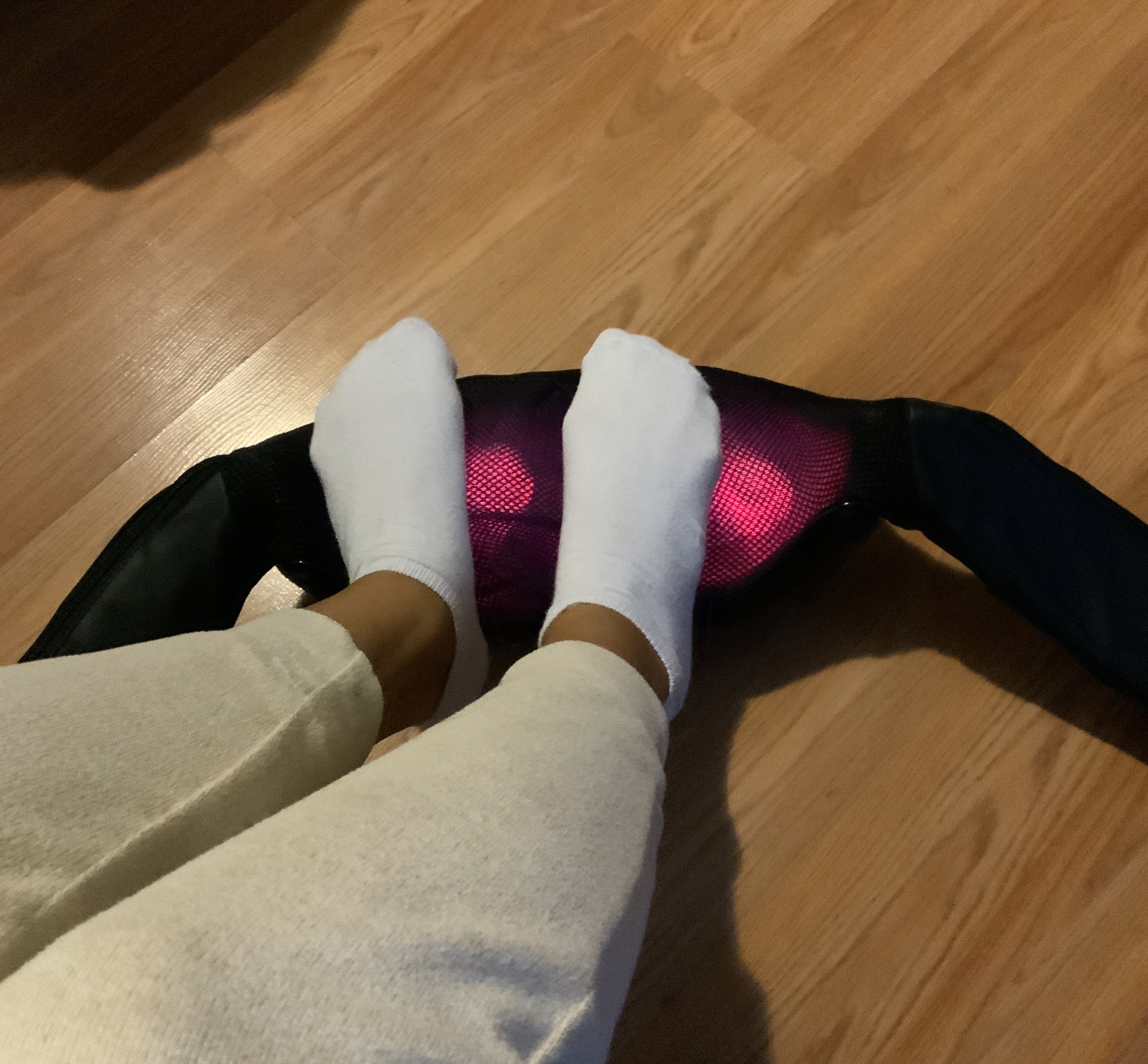 May using the massager on her feet