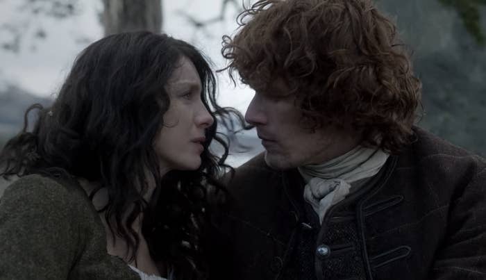 Jamie and Claire from "Outlander "looking lovingly into each other's eyes.