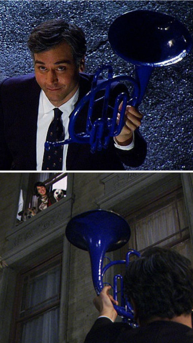 Ted holds a blue French horn for Robin