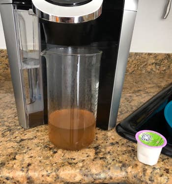Reviewer photo of coffee residue in water after using the cleaning K-cup