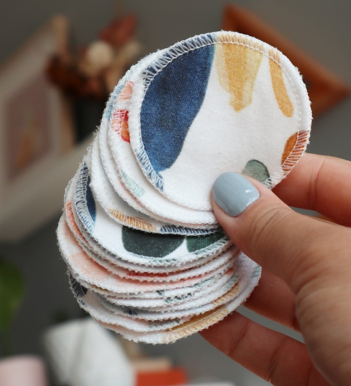 A person holding several pads