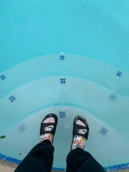 Feet on a frozen pool