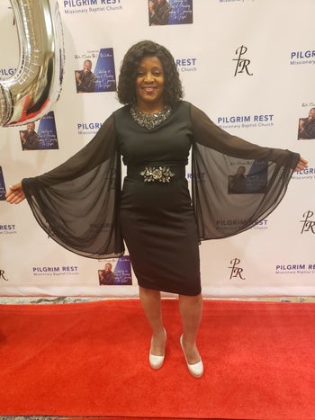 reviewer wearing the dress in black