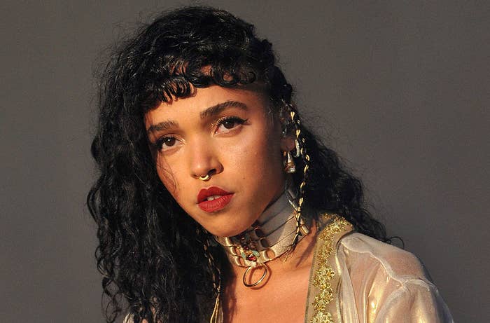 FKA Twigs wearing a choker necklace, bangs, and a septum piercing