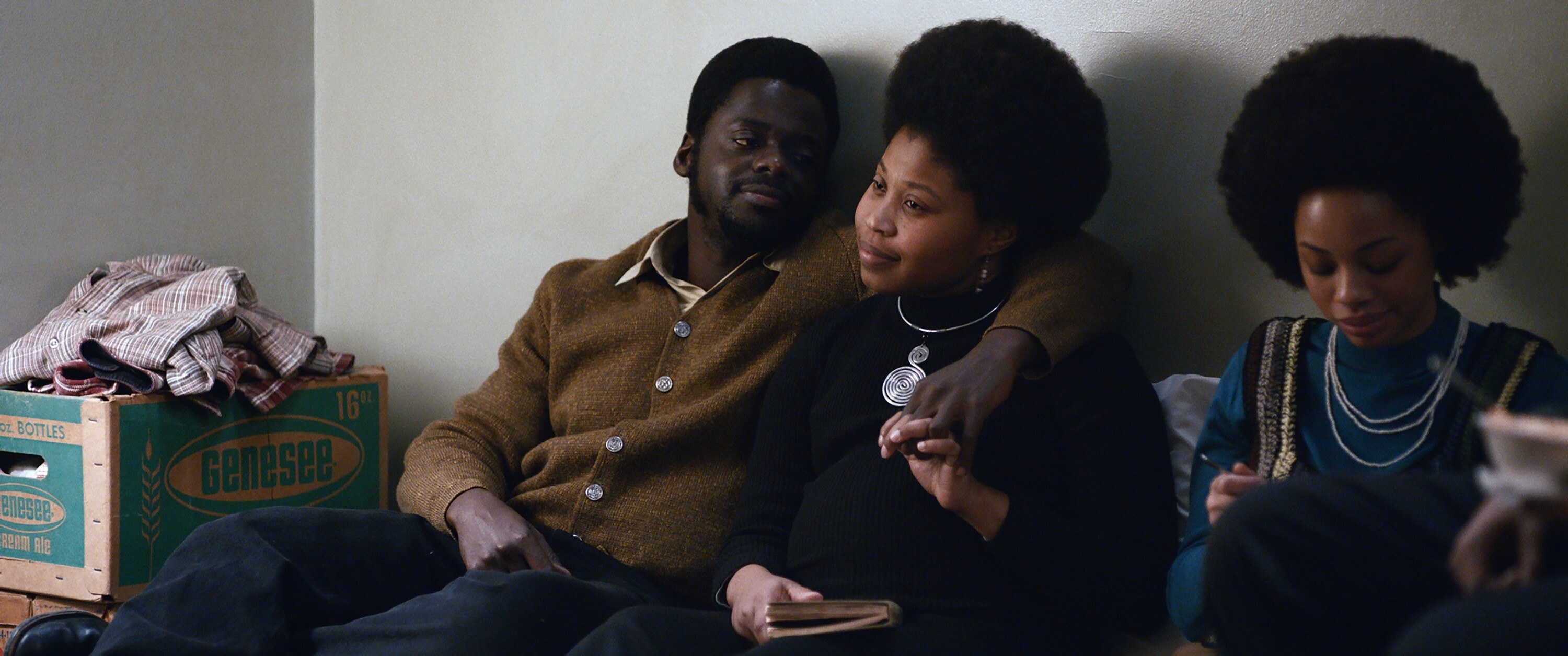 Daniel Kaluuya as Fred Hampton puts his arm around Dominique Fishback as Deborah Johnson