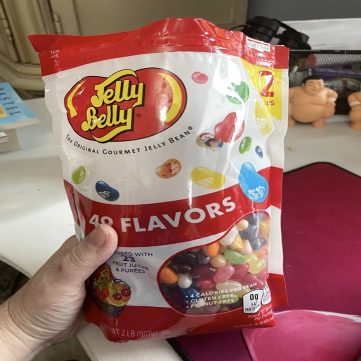 Holding a bag of Jelly Belly Jelly Beans

