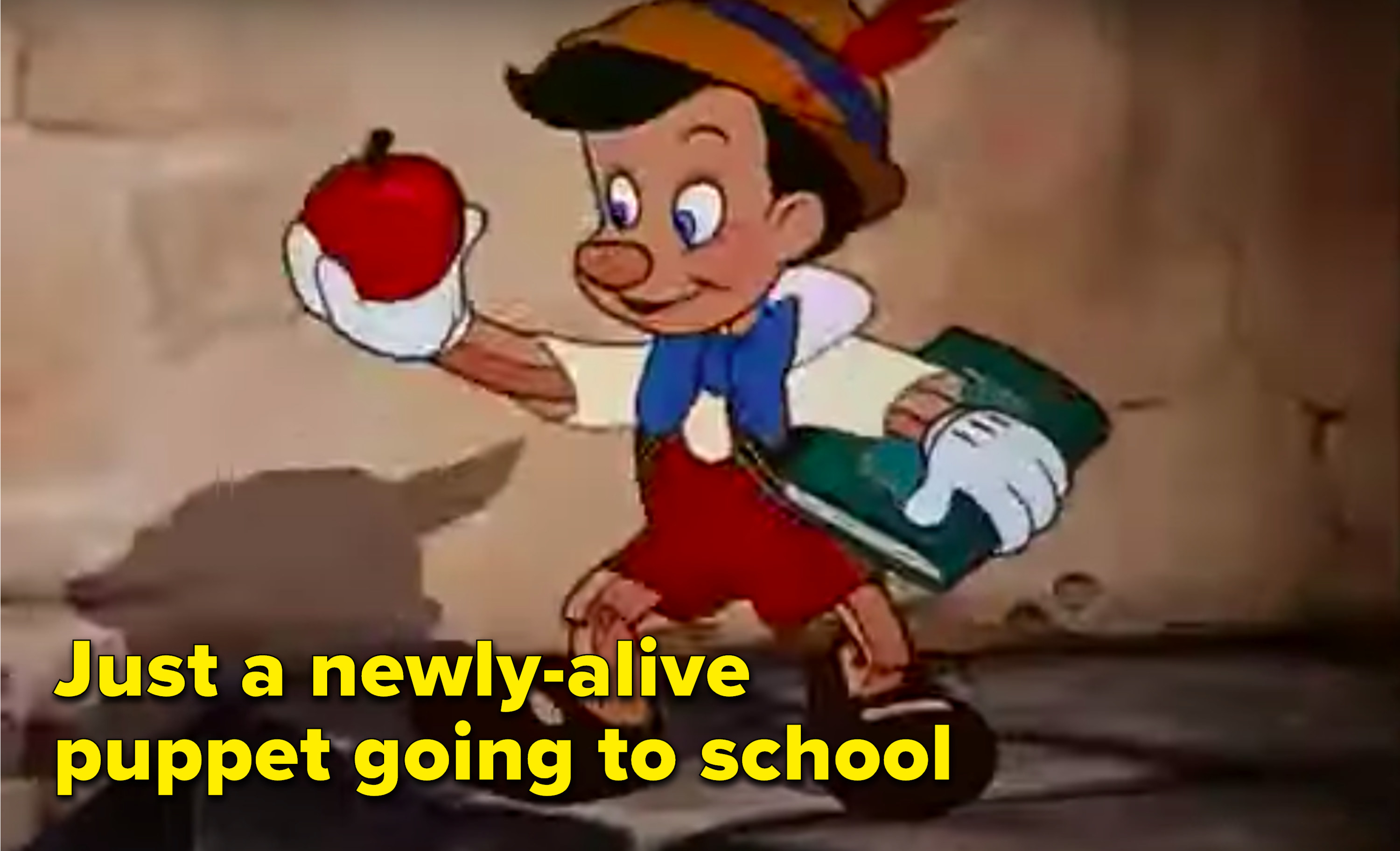 &quot;Just a newly-alive puppet going to school&quot; written next to Pinocchio holding a book and an apple