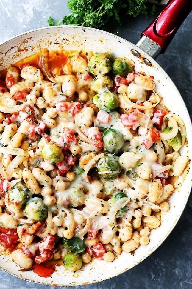Skillet gnocchi with veggies, chickpeas, and cheese.