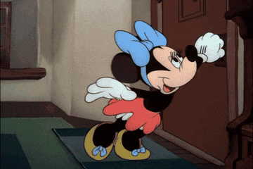 Minnie Mouse opening the door to a loving Mickey