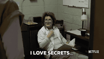 A woman saying &quot;I love secrets.&quot;