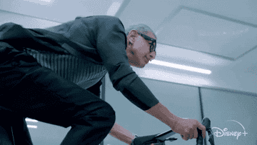 Jeff Goldblum riding a bike