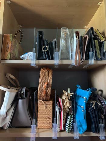 reviewer image of several acrylic shelf dividers organizing purses and clutches across two shelves
