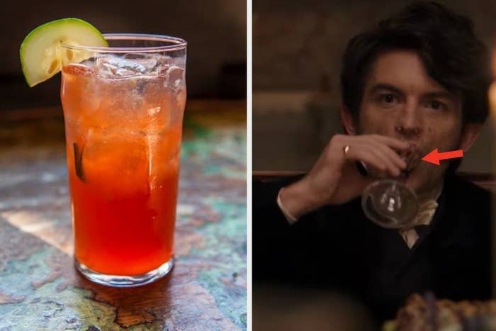 A cocktail glass is on the left with Anthony from "Bridgerton" sipping on the right