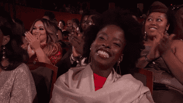 Amanda Gorman waving during an awards show