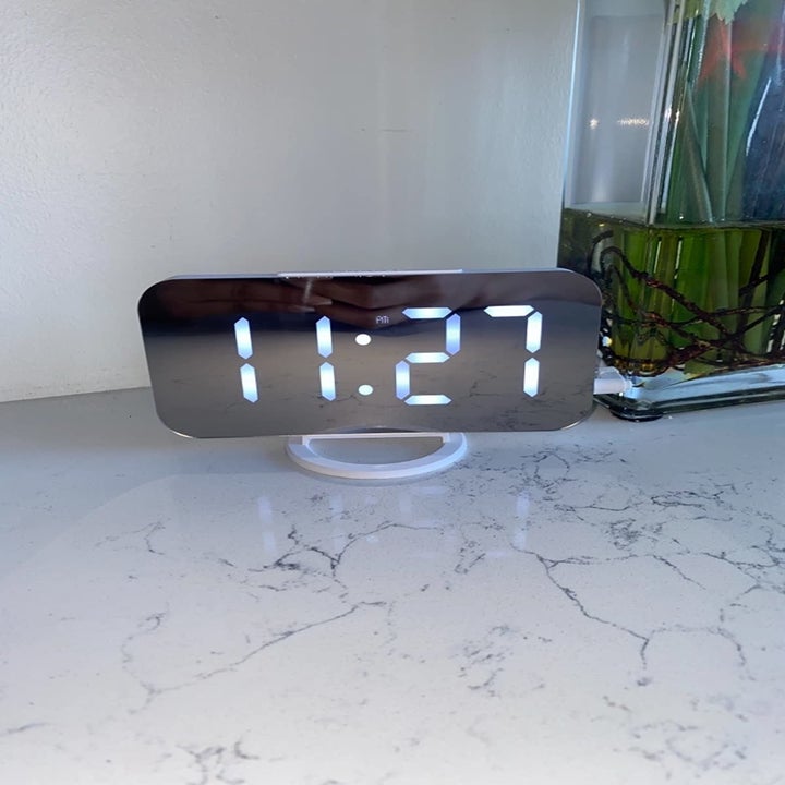Reviewer alarm clock on marble table