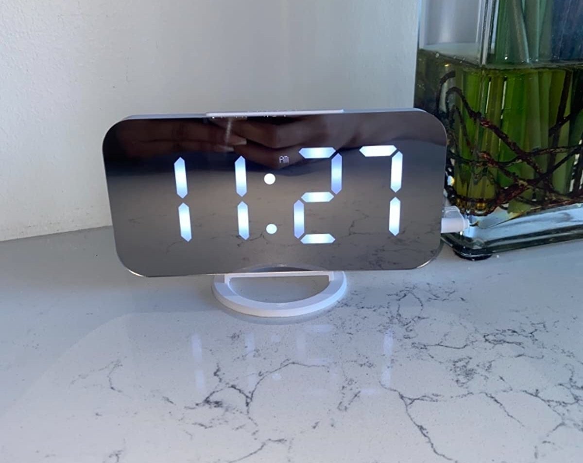 Reviewer alarm clock on marble table