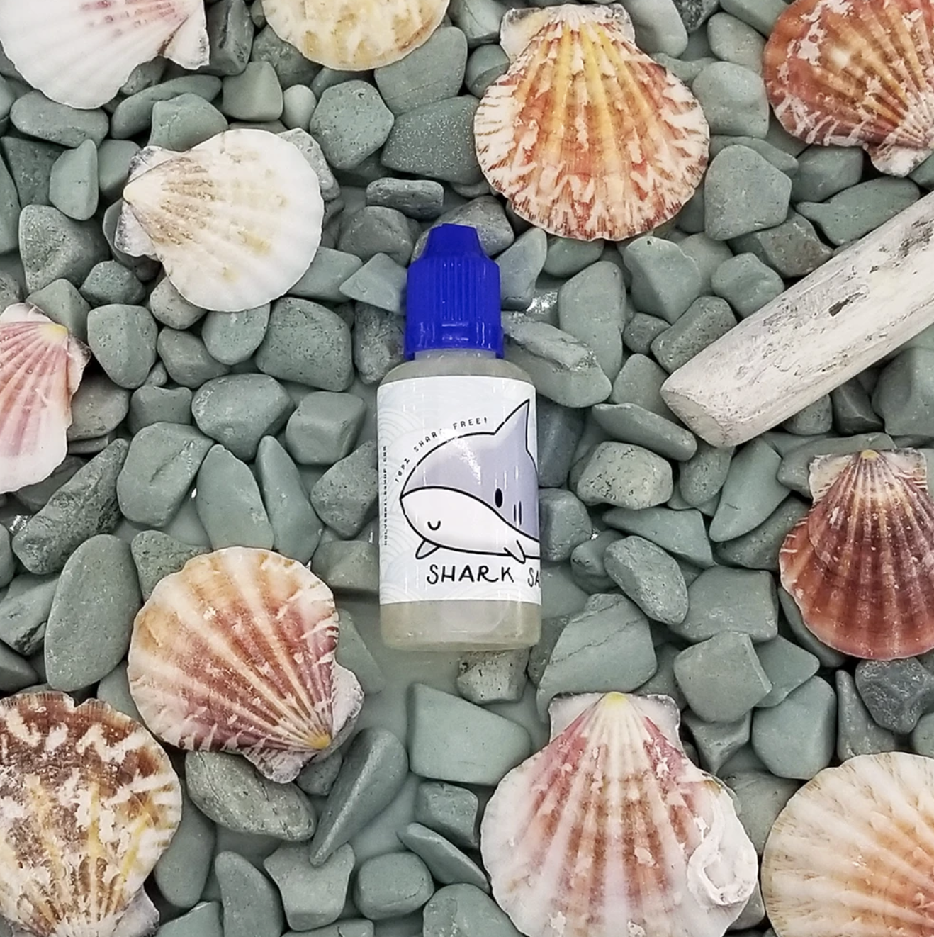 a picture of the product on top of seashells and rocks
