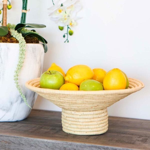 woven pedestal footed bowl with green apples and lemons