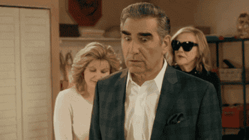 Johnny Rose turns over his shoulder, wide-eyed and in shock on Schitt&#x27;s Creek