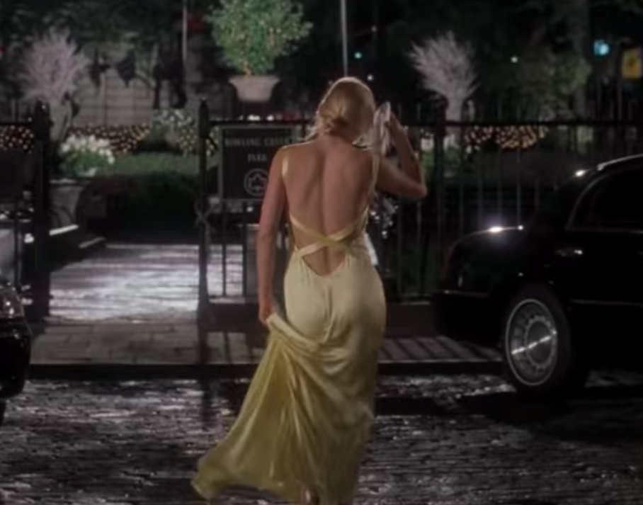 Andie wearing an essentially backless gown with straps