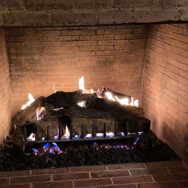 A fireplace taken from Travis and Kourtney's Instagram story