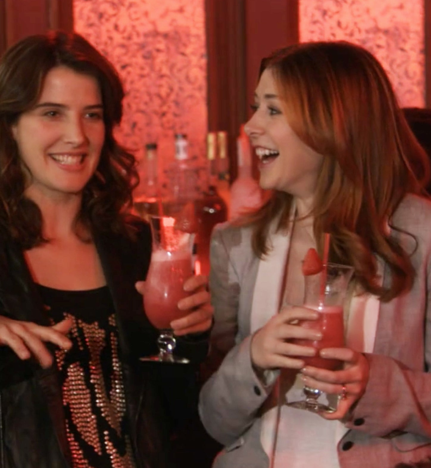 Robin and Lily having a drink at a bar in How I Met Your Mother