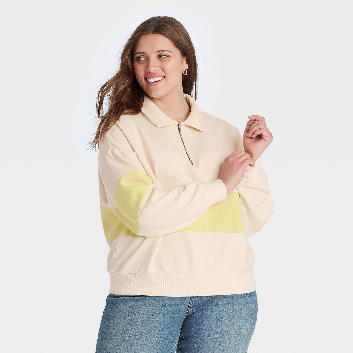 Model in Quarter Zip-Up High Neck Pullover Sweatshirt in yellow colorblock