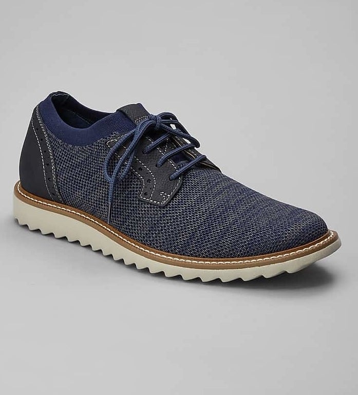 the blue knit sneaker with blue laces and white scalloped sole