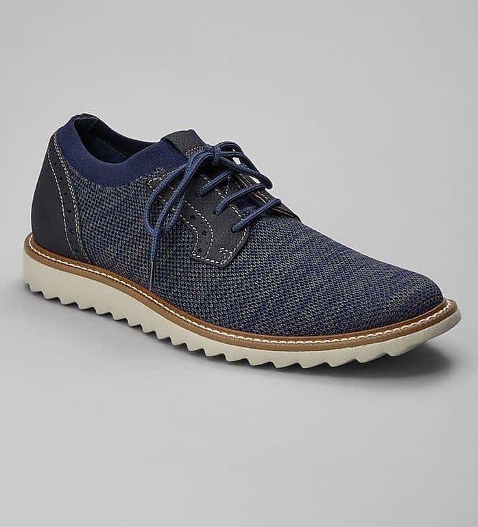 the blue knit sneaker with blue laces and white scalloped sole