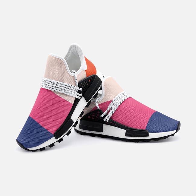 the blue, pink, and light pink stretchy sneakers with laces across the top