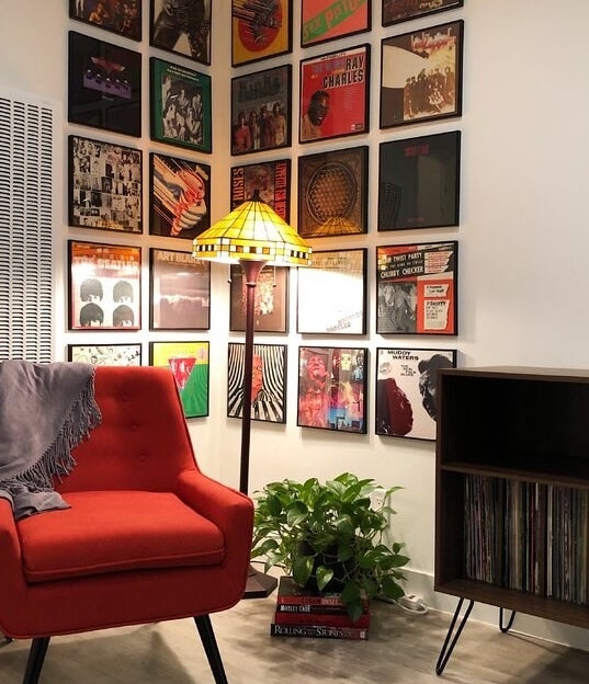 The audio rack, which has one large shelf to vertically store vinyl records, a smaller shelf for audio equipment or other related items, and hairpin legs