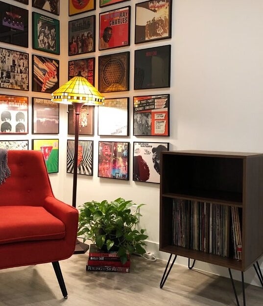 The audio rack, which has one large shelf to vertically store vinyl records, a smaller shelf for audio equipment or other related items, and hairpin legs