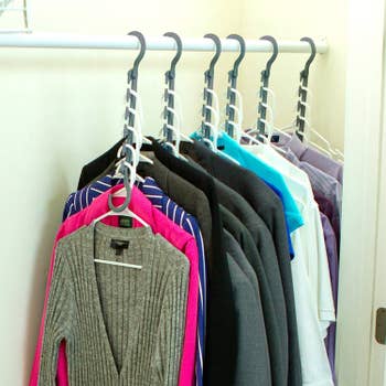 Product in use in closet, with the multiple clothes to a hanger being hung vertically