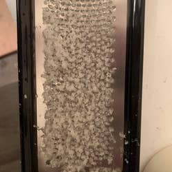 A reviewer's foot file filled with dead skin after being used
