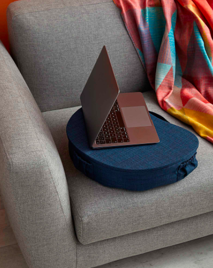 A laptop perched on the padded laptop shelf