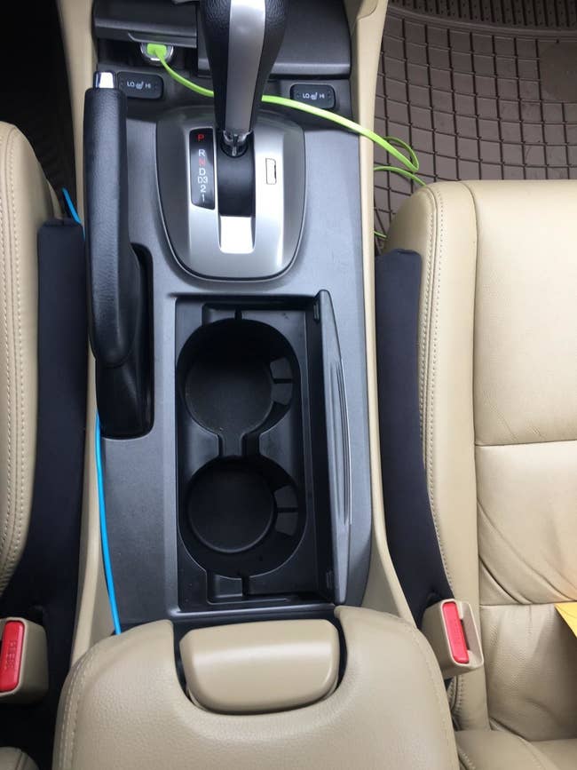 Reviewer photo of the car seat filler in use in vehicle