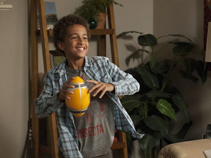 Jabbar holding a football