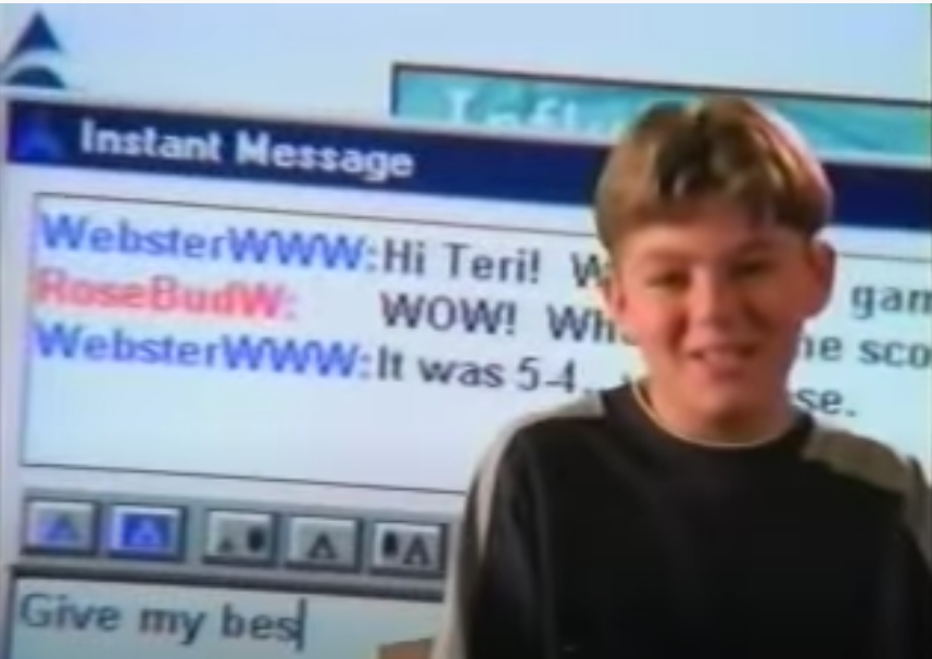 A screenshot of an AOL commercial featuring AIM in the background with a kid talking about it