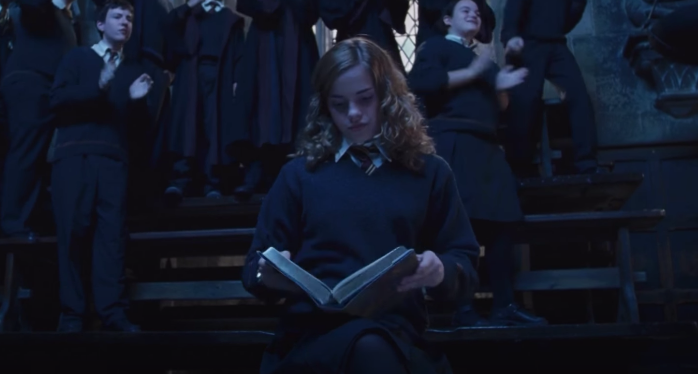 Hermione reading a book in "Harry Potter"