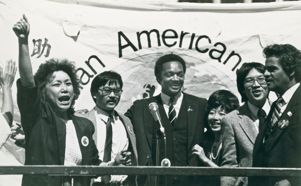 jesse jackson with fellow supporters at a rally in portsmouth square