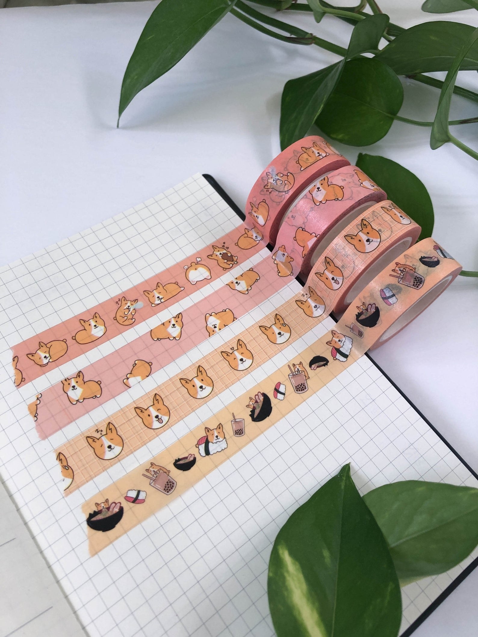 four rolls of the washi tape rolled across a journal page