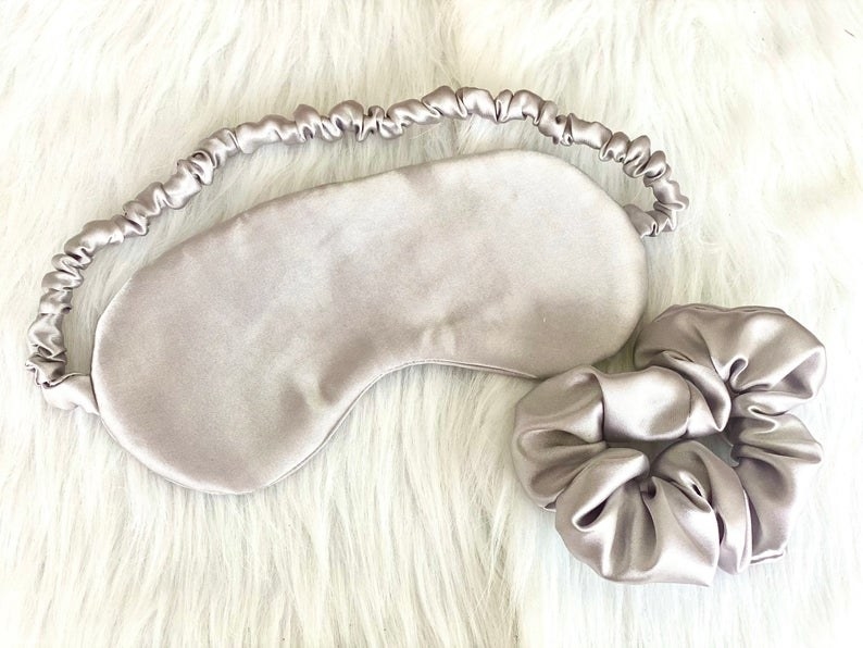 the sleep mask and the scrunchie next to each other 