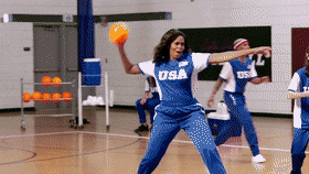Michelle Obama hitting Harry Styles with a dodgeball.
