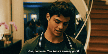 Peter Kavinsky holding up his phone screen with a picture of Lara Jean displayed, with the caption &quot;girl, come on, you know I already got it.&quot;