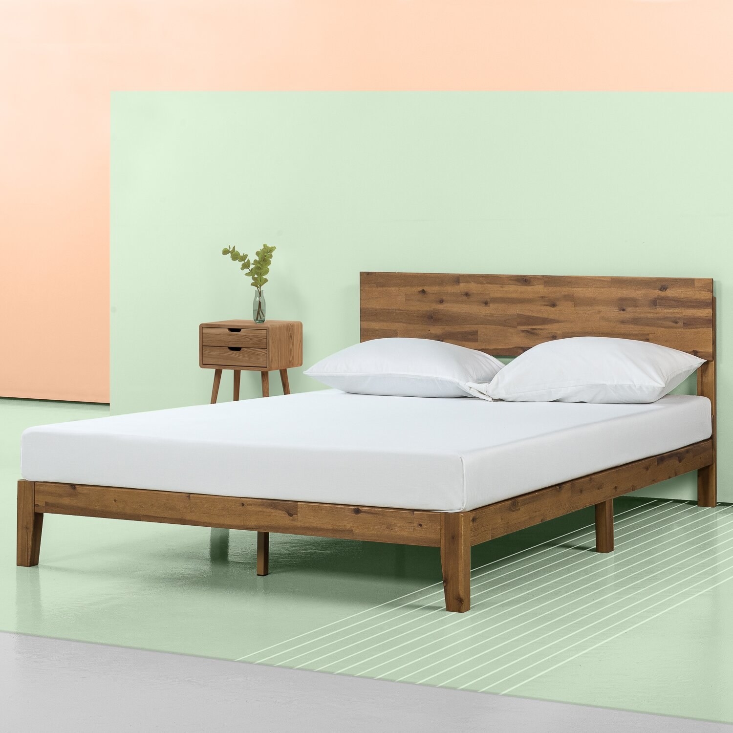 The bed, which is low to the ground, has a headboard, and visible wood grain