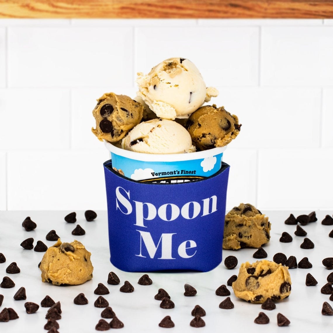 A pint of Ben &amp;amp; Jerry&#x27;s in the cozy that says &quot;spoon me&quot;