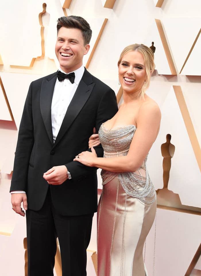 Colin Jost arm-in-arm with Scarlett Johansson at the 92nd Annual Academy Awards