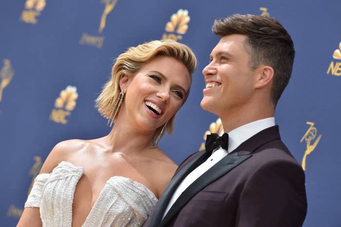 Scarlett Johansson and Colin Jost smile on the red carpet at the 70th Emmy Awards